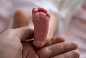 Close up of a newborn baby's foot.