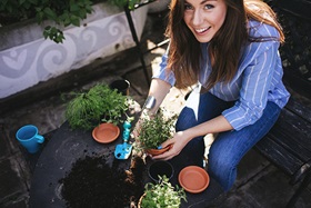 Woman in an herb garden.